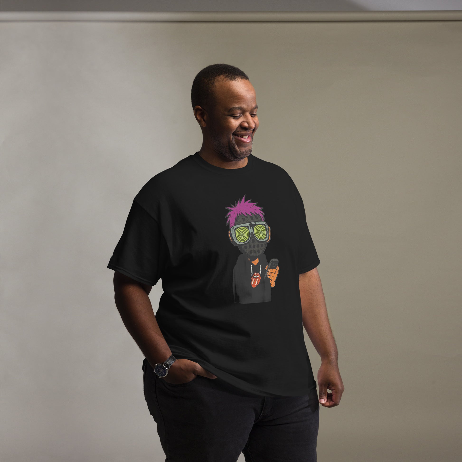 Man wearing a black t-shirt with a colorful graphic design on a plain background