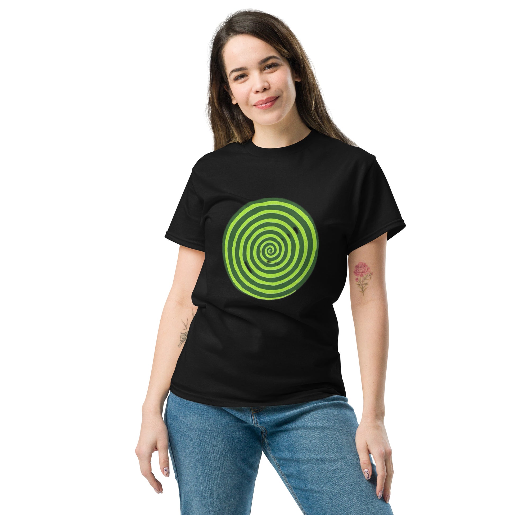 Woman wearing a black t-shirt with a green spiral design on a white background